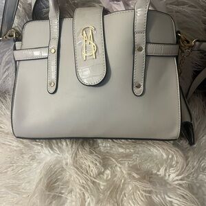 White Designer Handbag with Gold Accents